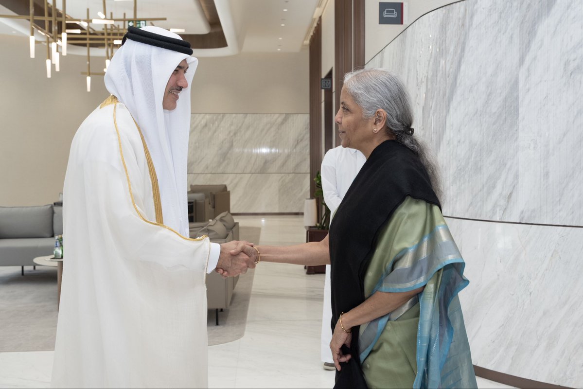 FinMinIndia's tweet photo. Union Minister for Finance & Corporate Affairs Smt. @nsitharaman met Dr. Ahmad bin Mohammed Al-Sayed, Qatar Minister of State for Foreign Trade @MOCIQatar, on the sidelines of the AIIB 2026 Annual Meeting in Doha, Qatar, today.

Dr. Ahmad bin Mohammed Al-Sayed warmly recalled his visit to India in 2025 and observed that there was considerable scope for investment in India in several infrastructure sectors including ports, airports, highways and power, and opportunities for Indian companies to invest in Qatar in areas including food security, pharmaceuticals, petrochemicals, education, health and start-ups.

FM Smt. @nsitharaman conveyed that India attaches high importance to enhancing trade and investment with Qatar, noting the elevation of bilateral ties to a “strategic partnership” during the State Visit of H.H. the Amir of Qatar in February 2025. She highlighted trade and investment as important pillars for adding strategic dimensions to the relationship.

The Union Finance Minister emphasised the importance of restoring normal trade between India and Qatar and other Gulf countries, including unimpeded maritime navigation and commerce through the Strait of Hormuz.

They also discussed the implementation of the $10 billion Qatari investment commitment and establishment of a QIA office in India. They both expressed keen interest in completing the Bilateral Investment Treaty with Qatar, for which they decided on accelerated engagement, as well as the Free Trade Agreement (FTA) negotiations.