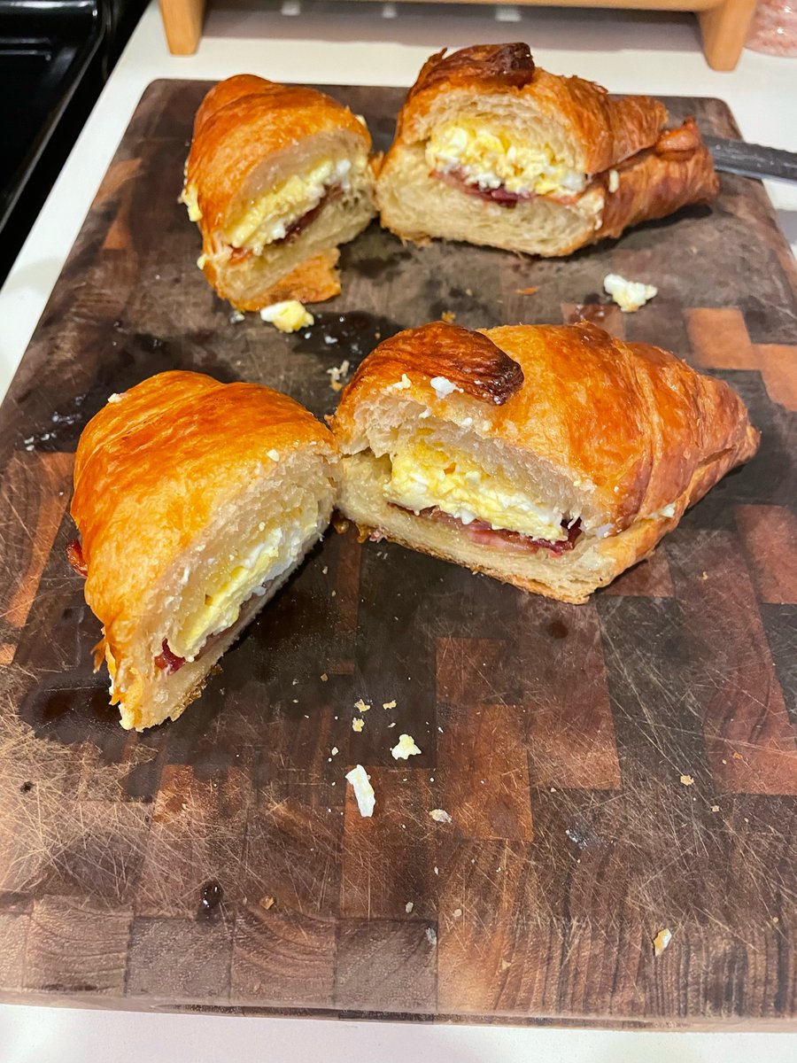 iandaydreams's tweet photo. bacon egg cheese croissant — crisp bacon, soft scrambled eggs, melted cheese on a toasted croissant. ~15–20 min. @platedbot

skillet + toaster oven
• 1 croissant, split and toasted
• 2–3 strips bacon
• 1–2 eggs, soft scrambled
• Shredded white cheese
• Butter for the cut faces
1. Cook bacon medium until crisp; leave a thin film of fat.
2. Soft-scramble eggs in the fat; melt cheese on at the end.
3. Butter-toast the croissant cut sides.
4. Stack bacon + cheesy eggs; close and cut.