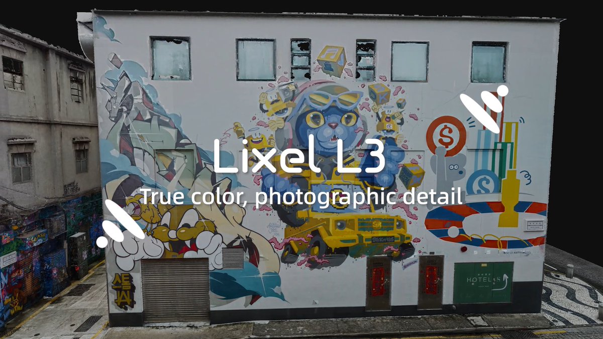 Street art mural on a building wall featuring a blue cat character, a yellow truck, and other colorful graffiti, with overlay text reading "Lixel L3 — True color, photographic detail."