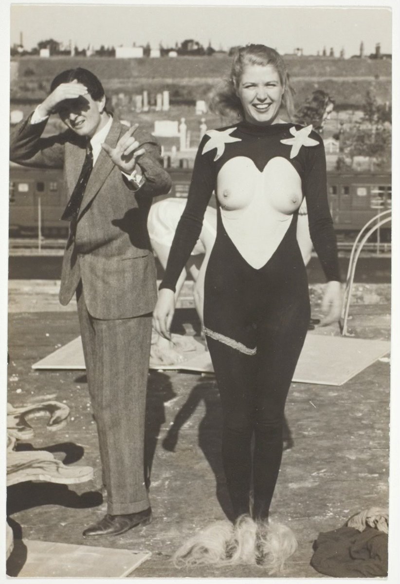 BadSpit's tweet photo. English poet and patron Edward James with a costumed model at Salvador Dalí’s "Dream of Venus" pavilion during the 1939 New York World's Fair. https://t.co/07n6KwlyzN