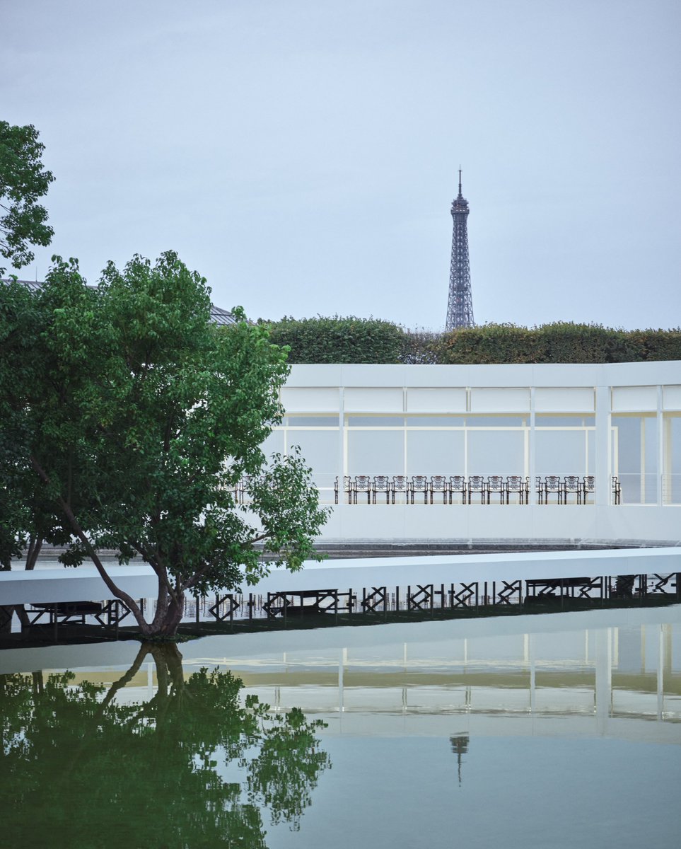 Dior's tweet photo. The Dior Summer 2027 Women’s show was held at Le Bassin Octogonal in the Jardin des Tuileries, Paris, where a cluster of camphor trees was especially installed. They will be replanted in the Tuileries and continue to flourish in the years to come.

https://t.co/ijL6mIZwTH

#DiorSummer27
