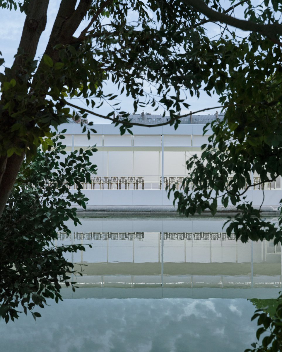 Dior's tweet photo. The Dior Summer 2027 Women’s show was held at Le Bassin Octogonal in the Jardin des Tuileries, Paris, where a cluster of camphor trees was especially installed. They will be replanted in the Tuileries and continue to flourish in the years to come.

https://t.co/ijL6mIZwTH

#DiorSummer27