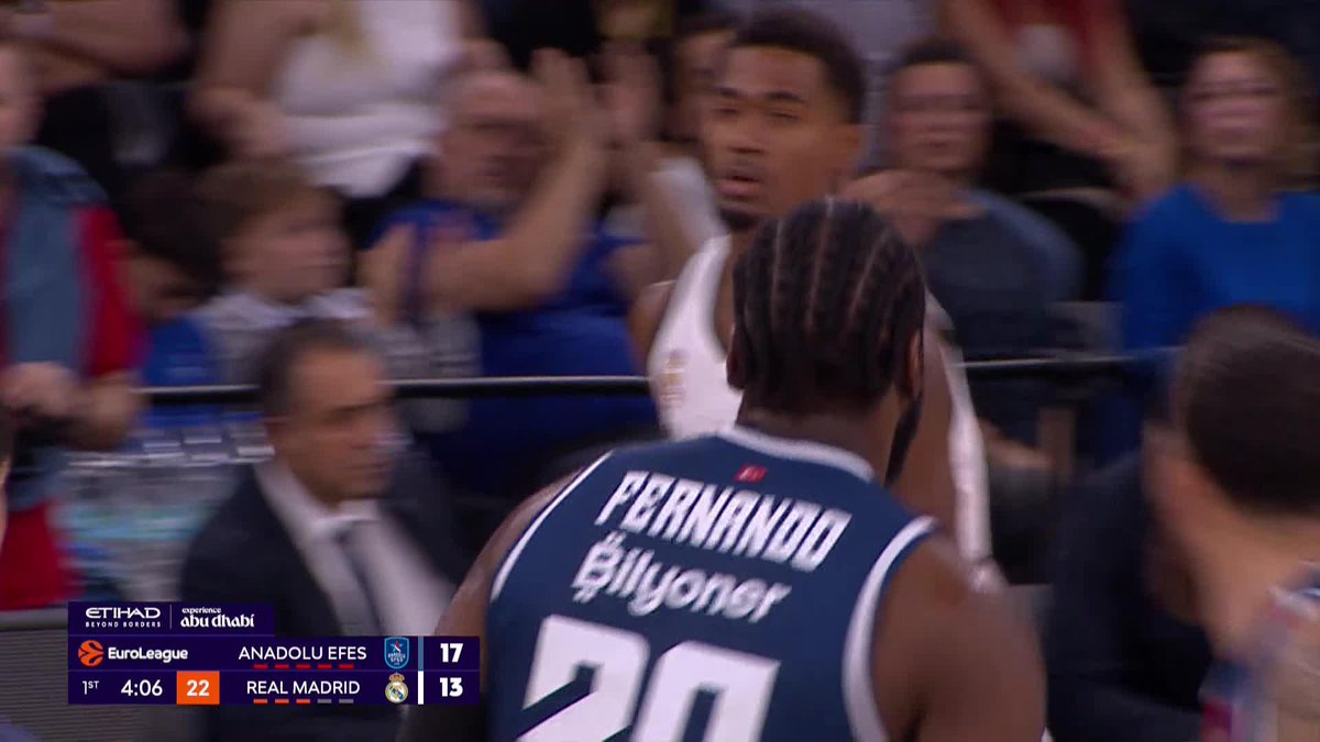 Real Madrid's Bruno Fernando faces off against an Anadolu Efes player during a EuroLeague basketball game, with Anadolu Efes leading Real Madrid 17-13 with 4:06 remaining in the 1st quarter.