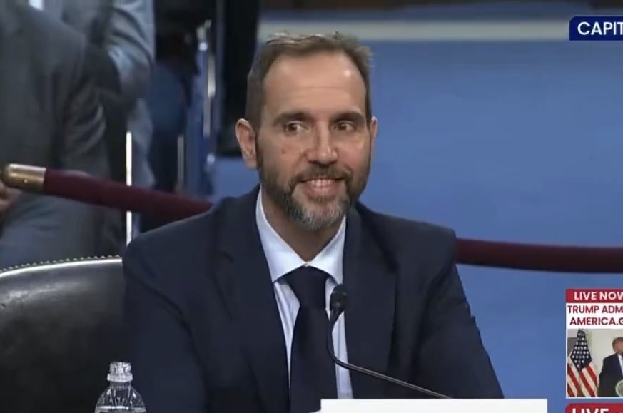 RonFilipkowski's tweet photo. The moment Jack Smith realized Eric Schmitt was talking about the wrong game. https://t.co/jI4zGQwjJs