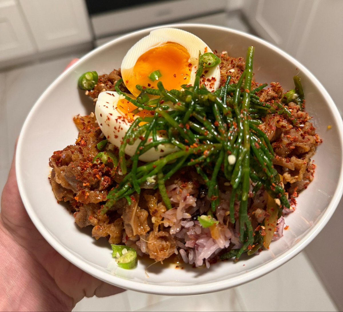 bennybitters's tweet photo. beef bulgogi w/ purple rice, thai chili, soft egg &amp; sea bean kimchi https://t.co/KQXreTpeFY