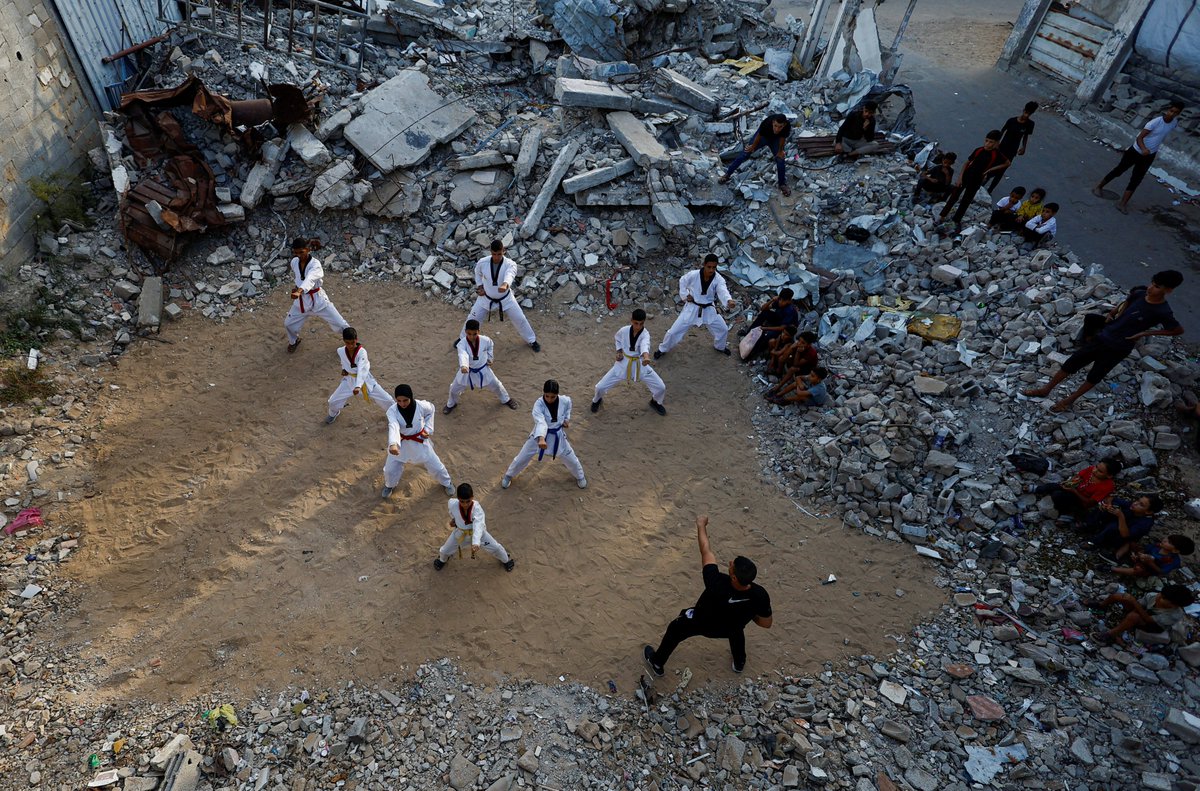 AJEnglish's tweet photo. Palestinian youth practise taekwondo amid the rubble of destroyed buildings in Nuseirat in the central Gaza Strip, Palestine.

🔴 LIVE updates: https://t.co/gSEVNKn8lo https://t.co/zN4KjXOIY5
