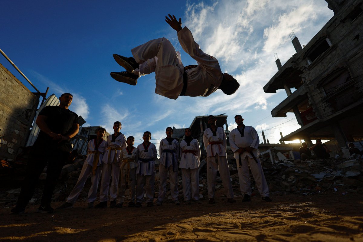 AJEnglish's tweet photo. Palestinian youth practise taekwondo amid the rubble of destroyed buildings in Nuseirat in the central Gaza Strip, Palestine.

🔴 LIVE updates: https://t.co/gSEVNKn8lo https://t.co/zN4KjXOIY5