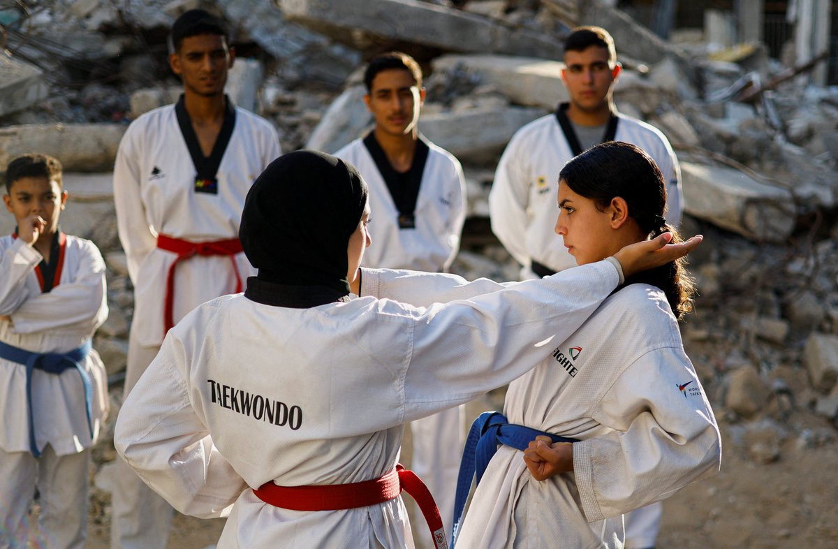 AJEnglish's tweet photo. Palestinian youth practise taekwondo amid the rubble of destroyed buildings in Nuseirat in the central Gaza Strip, Palestine.

🔴 LIVE updates: https://t.co/gSEVNKn8lo https://t.co/zN4KjXOIY5