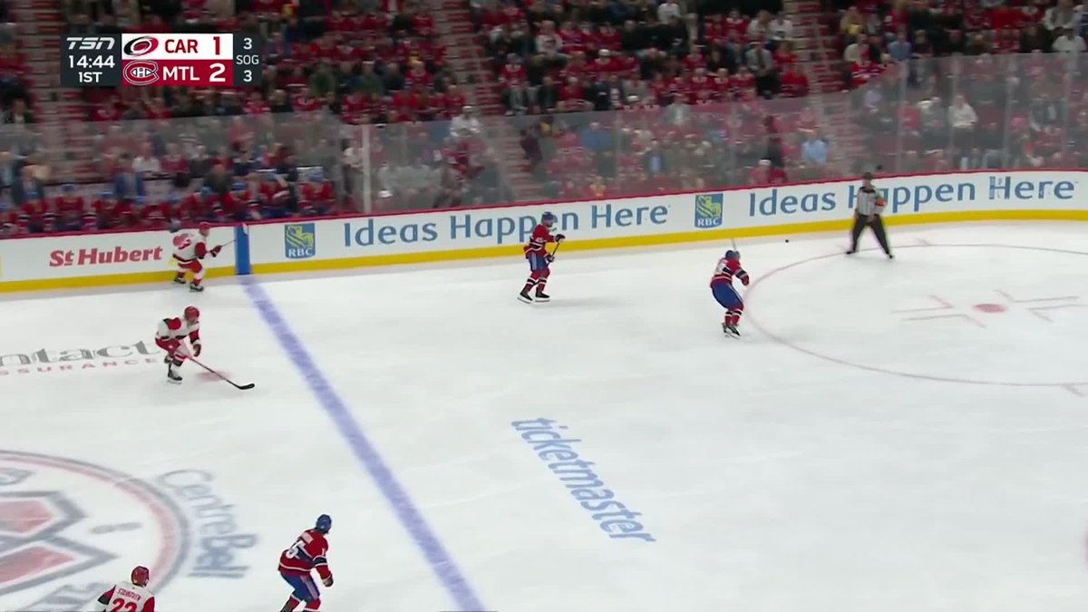 A hockey game broadcast shows the TSN scoreboard reading "CAR 1, MTL 2" with 14:44 remaining in the 1st period on a SOG (shot on goal) tally of 3-3. Montreal Canadiens players in white and red jerseys are skating on the ice during what the accompanying post describes as an early-game goal sequence by Captain Suzuki.