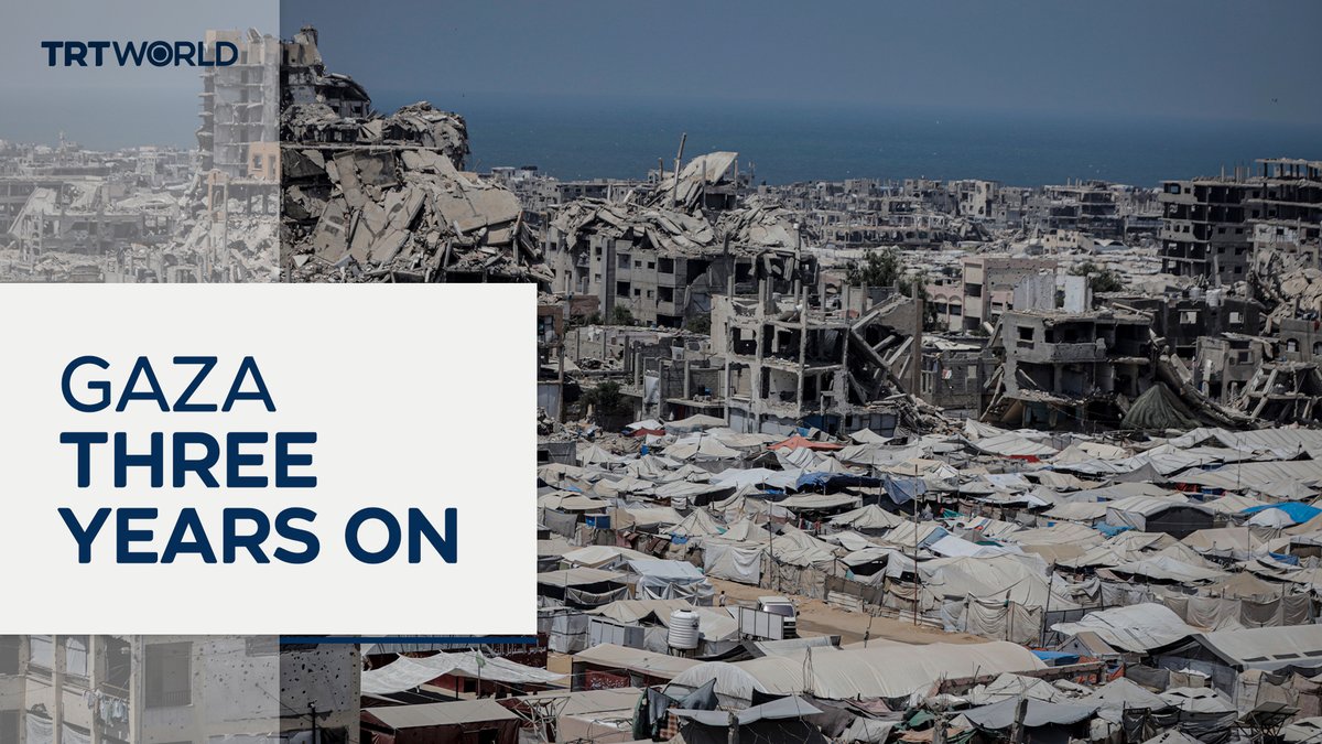A TRT World thumbnail titled "GAZA THREE YEARS ON" shows a devastated cityscape with collapsed buildings in the background and a sprawling encampment of tents in the foreground, visually capturing the massive displacement and destruction referenced in the caption about the ongoing war's toll on the enclave.
