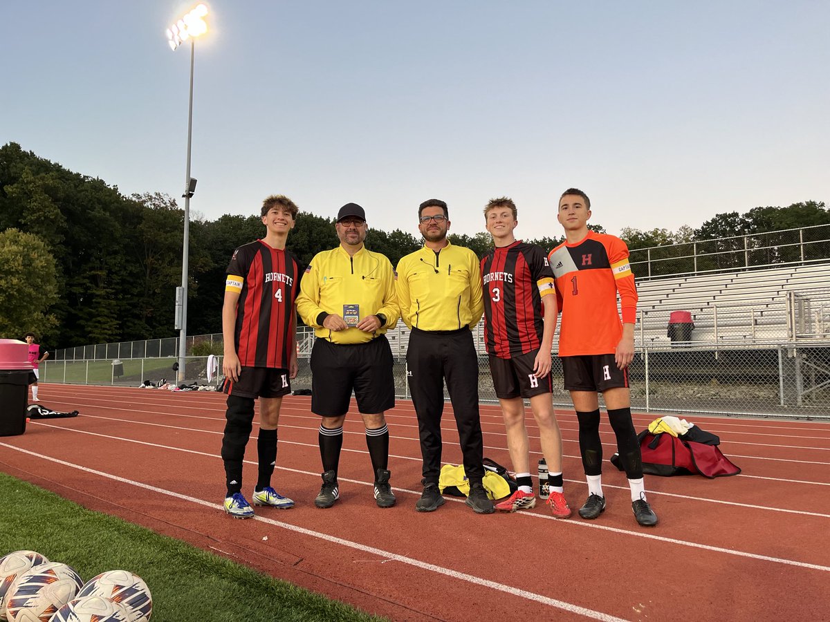 HSD_Athletics's tweet photo. Boys soccer team captains Noah Nesaw, Mason Tonty, and Brody Gordon present Tuesday night’s home game refs with gifts in recognition of PIAA Referee Appreciation Week! @District10_PIAA @PIAASports https://t.co/DOSwXuChRZ