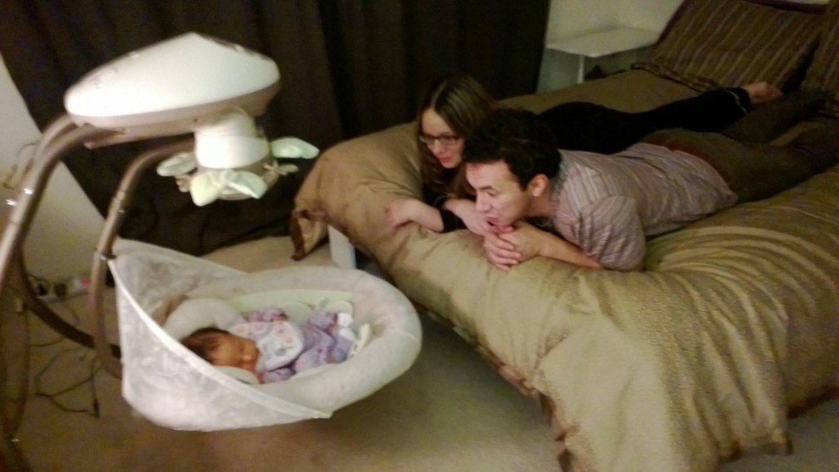 Fleightondiaz's tweet photo. My husband and I, 13 years ago, when we had first become parents. I remember we’d just stare at her for hours, amazed. https://t.co/Pa0tw7dc04