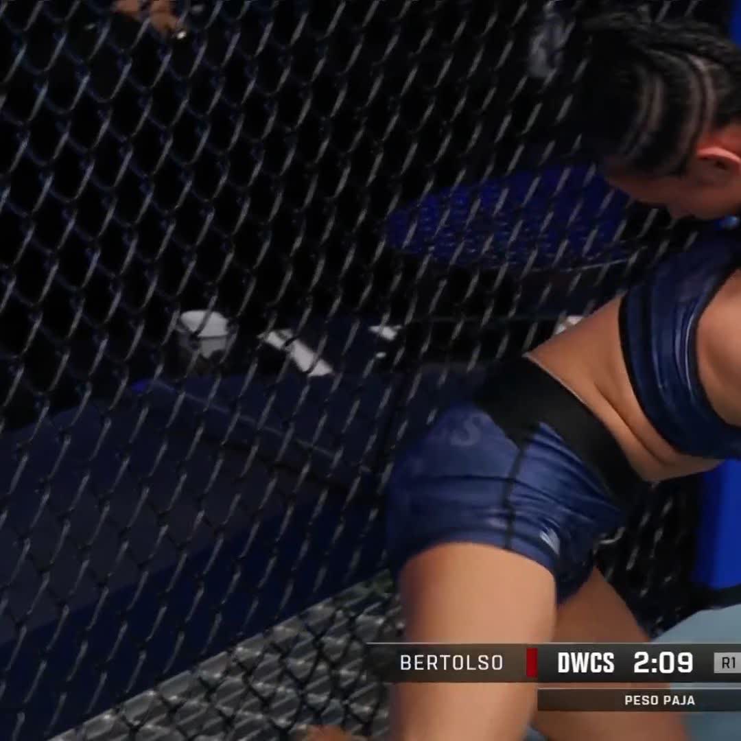 A female MMA fighter in blue shorts and a blue top stands near the cage, with on-screen text reading "BERTOLSO," "DWCS 2:09," and "PESO PAJA," indicating the second round is underway in a strawweight bout. The image captures Bertolso in the fight referenced in the post, where she would go on to secure a submission victory by guillotine choke.