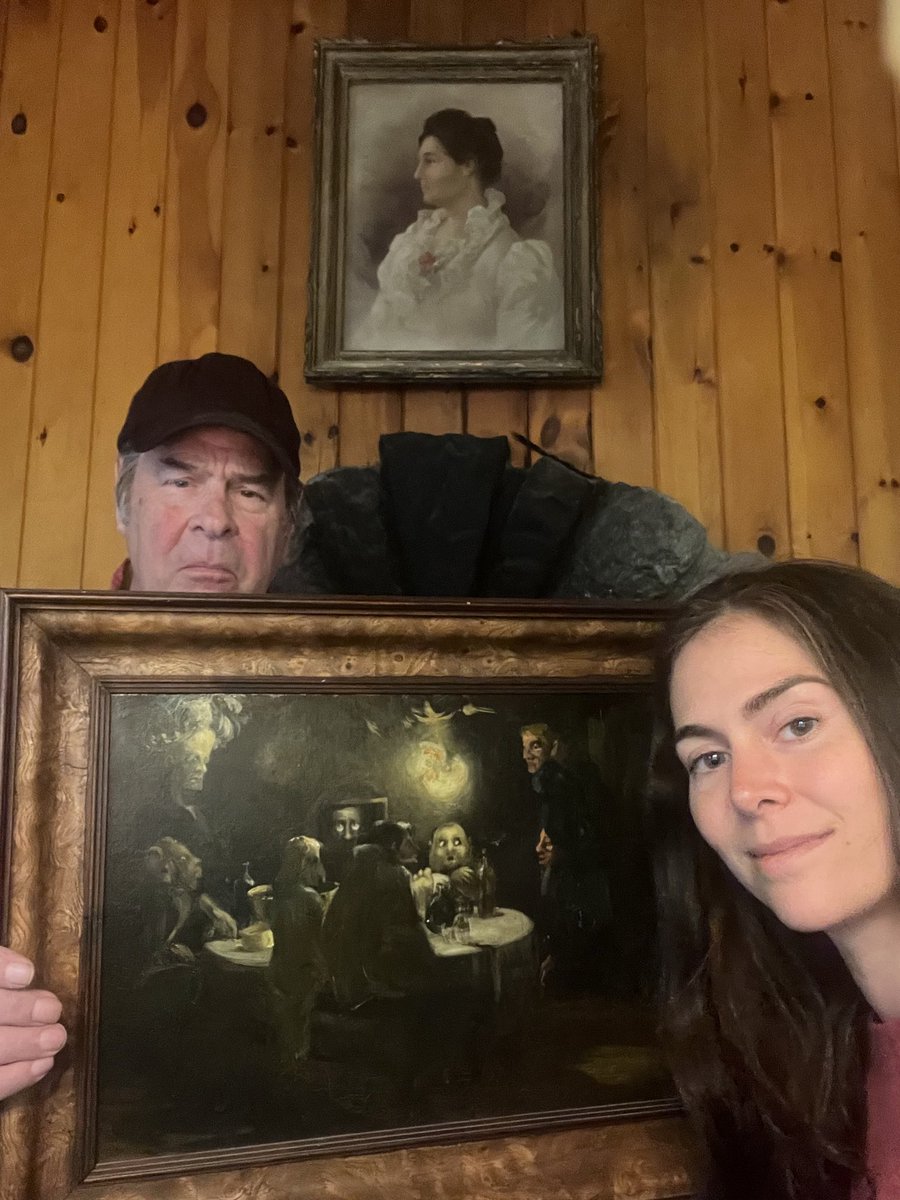 dan_aykroyd's tweet photo. My daughter Danielle and I wanted to share one of our family treasures from the Seance Room in the Old Farmhouse. We believe this is one of the eeriest and most wonderful seance depictions ever painted. Check out the details. Here’s a secret: if you flip it upside down the little wispy white and orange spirit is a skull. Anyone know who painted this?
