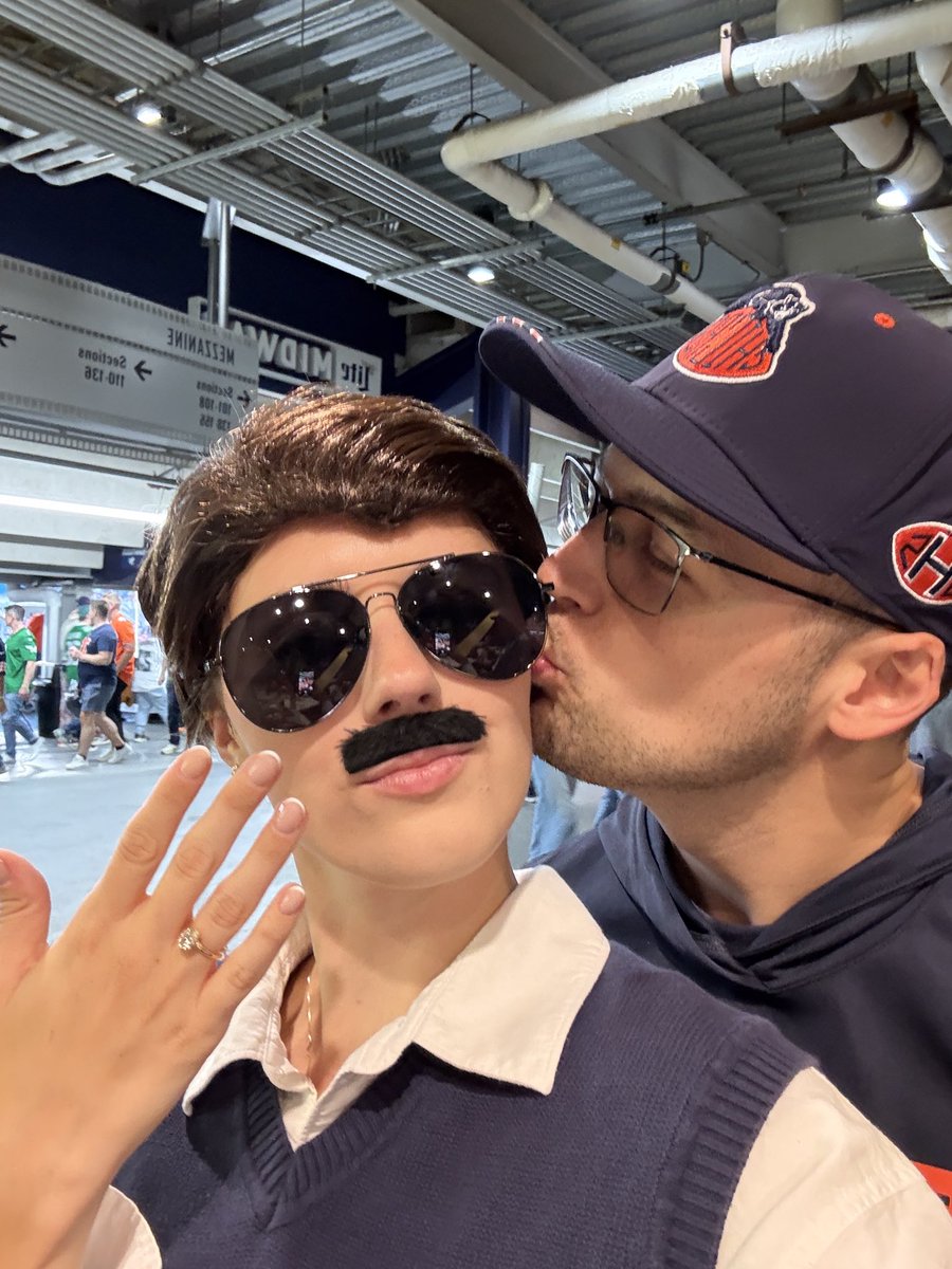 MeganAshlyBrown's tweet photo. For those here from the Mike Ditka and Ben Johnson kissing video- WE JUST GOT ENAGAGED! 🧡💙🐻⬇️🏈 #beardown #benjohnson #mikeditka #engaged https://t.co/DKz5QtzU09