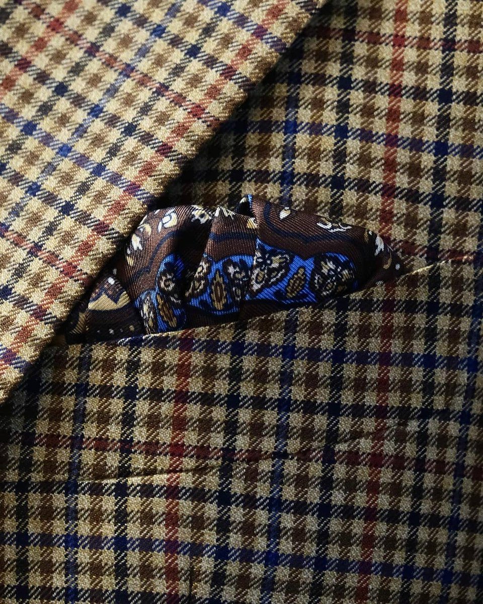 dieworkwear's tweet photo. Yes.

If you like the look of tweed but live in a warmer climate or don't want to look too rustic, here is what you should know when shopping.

Let's start with the basics. In men's tailoring, fabric comes in different weights, from 3oz per square meter (used for summer shirts) to 32 oz per square meter (used for heavy overcoats).

Most men's suits and sport coats are made from fabrics ranging from 8oz to 16 oz, with the 12oz to 14oz range considered mid-weight by most tailors.

If you run warm or live in a warmer climate, you can go for lighterweight fabrics (although, as a general rule, you should always wear the heaviest fabric you can bear, as this material hangs better and is more forgiving in terms of tailoring).

But there's another important dimension buried deep in the yarn. Broadly speaking, there are two types of yarn: worsted and woolen. Perhaps these terms should be renamed combed and uncombed, because the combing process mostly distinguishes them.

Before fibers are spun into yarn, they can be combed, which aligns the hairs and removes the shorter fibers. Once spun, this creates a stronger, smoother yarn known as worsted. Conversely, the shorter fibers can be left in, producing what's known as woolen yarn.

Worsted is what you see hanging on the rack when you shop for wedding suits (e.g., smooth navy and gray suits you associate with formal occasions or business meetings). Woolen is what you will think of when you imagine tweed.

I've attached four photos below. In the first two photos, we see Harris Tweed, which is purely made from woolen yarns. Notice how the fabric is very spongy, thick, and hairy. This is the effect of short and long fibers being mixed together and pointing in every direction. This is a 15/16oz fabric.

In the last two photos, we see a sport coat made from Harrison's Glorious Twelfth fabric, which is made with worsted yarns (it may be a blended woolen/ worsted, but there's definitely a strong presence of worsted). Notice how the fabric is smoother, which results from removing the shorter fibers. Because the resulting yarn is more resilient, the weaver can produce a lighter-weight cloth. This is a 10/11oz fabric.

Switching from woolen to worsted does three things. As mentioned, it allows you to produce lighter-weight materials. Second, it creates a smoother fabric, which traps less heat. Fuzzy materials create a ton of air pockets, which is what keeps you warm. Third, it makes the jacket look less rustic. Mark Dunsford, director of Harrison's of Edinburgh (my favorite fabric merchant), once described his Glorious Twelfth fabric to me as "city tweeds."

Unfortunately, most ready-to-wear clothiers will not give you this kind of granular information (a fault of both fashion media and retail, which still focus more on communicating trends than on clothing construction). So you will have to learn how to distinguish these things by feel. But with practice, you can find the right tweed by thinking about fabric weight and worsted/woolen yarns.