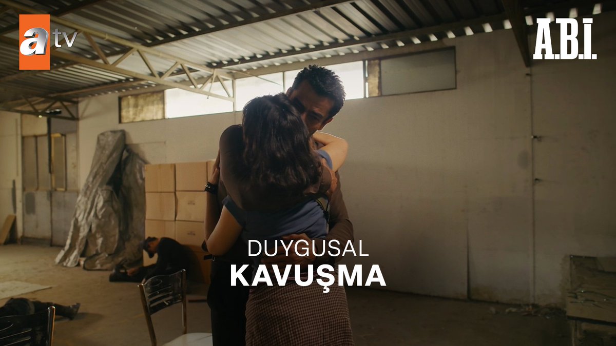 A man and woman embrace tightly in what appears to be a warehouse, with another person visible in the background, under the Turkish text "DUYGUSAL KAVUŞMA" (Emotional Reunion) on the atv series A.Bİ.