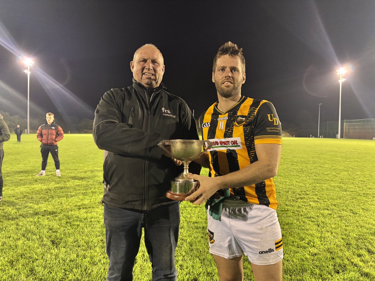 MidTipp's tweet photo. 💙💛 FRS Cahir Mid Junior B Football Champions 💙💛

Congratulations to Upperchurch Drombane who collected the Junior B Football Championship this evening with a 2-13 to 1-06 win over Thurles Gaels. 

Captain Colm Ryan collecting the trophy from Chairman and Sponsor Martin Bourke https://t.co/KkIN3DJEI8