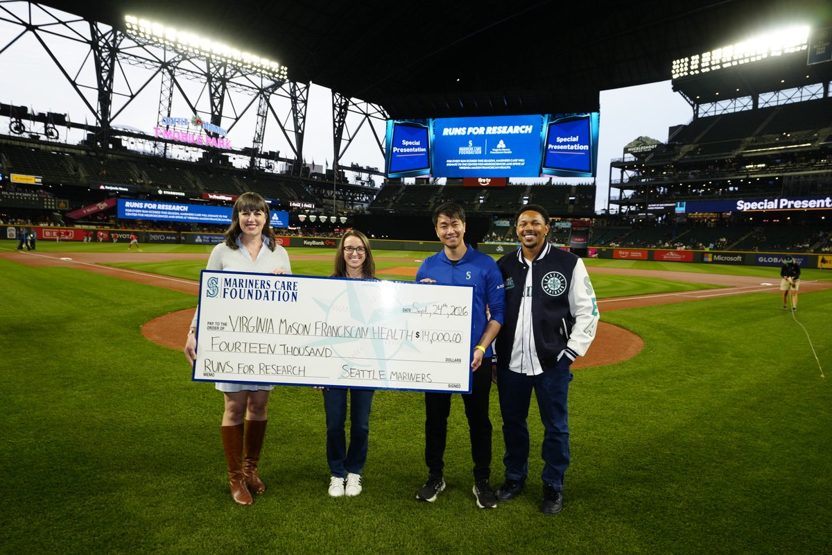 VMFHealth's tweet photo. A home run for neuroscience! The Center for Neurosciences and Spine at Virginia Mason Franciscan Health accepted a check from the Seattle Mariners at T-Mobile Park, representing donations from the "Runs for Research" program. https://t.co/BuQ4RhHddD