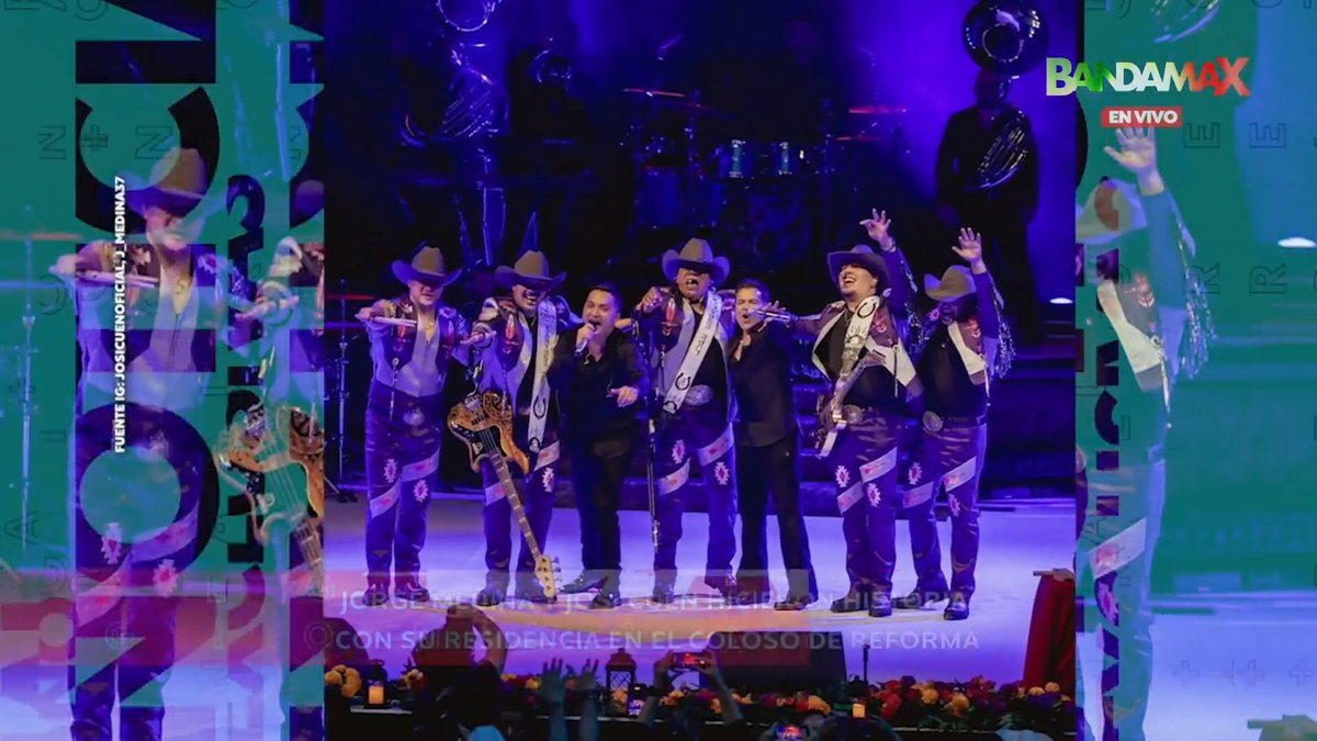 A live concert performance by the Mexican band Banda MS, with members in matching cowboy hats and charro suits on stage, broadcast on Bandamax 'EN VIVO' from 'EL COLOSO DE REFORMA'.