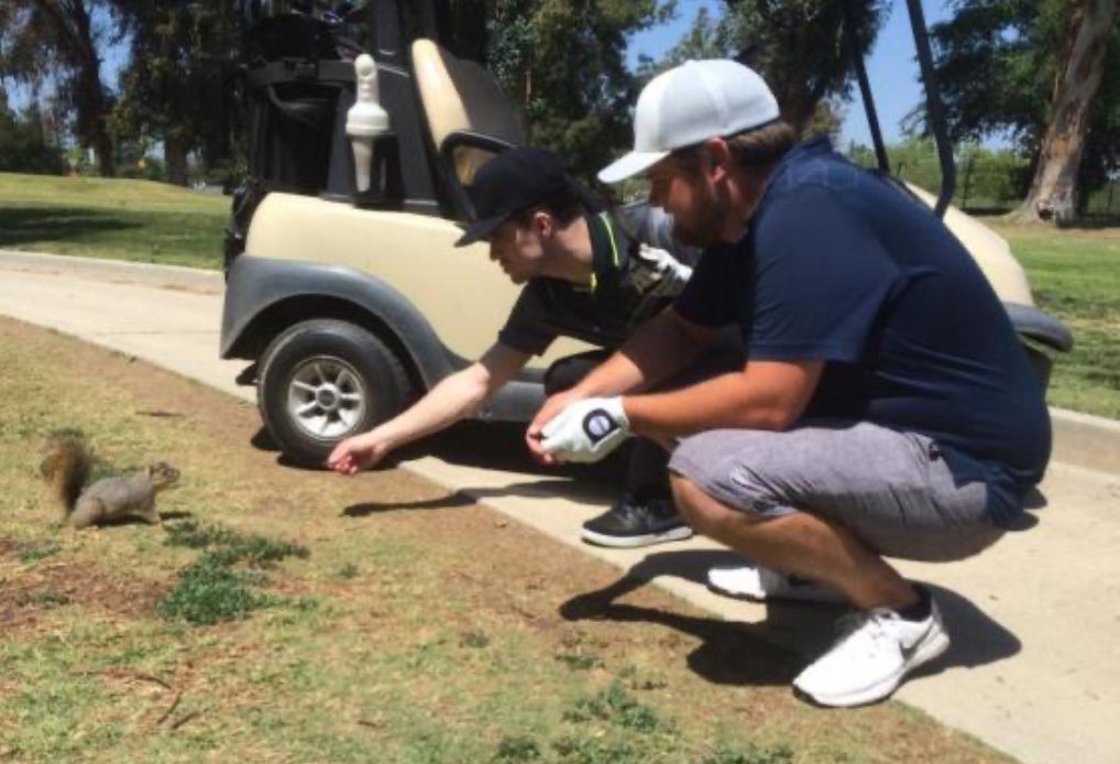 brenceratops's tweet photo. brendon and spencer feeding a squirrel https://t.co/QeWRqC8gPq
