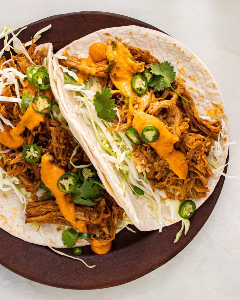 TestKitchen's tweet photo. These Goan-Inspired Braised Pork Tacos combine fall-apart tender pork spiced with cloves, cinnamon, and chiles, finished with vinegar to cut the richness. https://t.co/lpyHVO9Llw https://t.co/5gMHpladYu