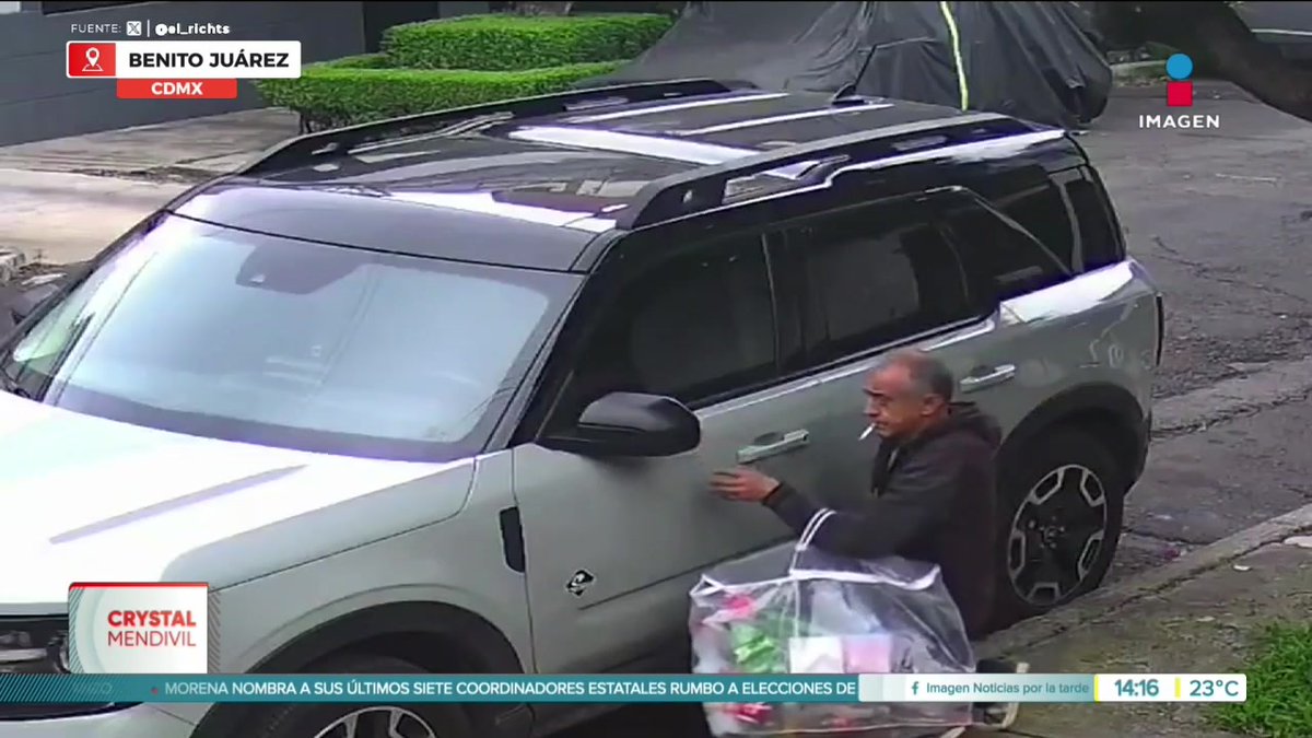 A surveillance camera clip from Imagen Noticias shows a man smoking and approaching a gray SUV on a street in Benito Juárez, CDMX, with a Crystal Mendivil news segment and a ticker about MORENA coordinators.