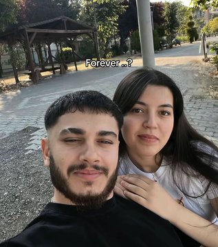 A couple poses closely together for a selfie outdoors, with the text "Forever ..?" displayed above them—creating an ironic contrast with the caption's frustration, suggesting their relationship is enduring while something else has "ruined" him.