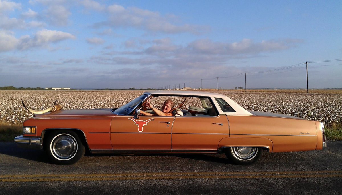TracesofTexas's tweet photo. This is a photo of Texas Longhorn superfan Scott Wilson in his longhorn-themed Cadillac. Scott was undoubtedly on his way to a game when this was taken. Before he died last year at the age of 74, Scott had seen 595 longhorn games in a row, without missing a single one.  Considering all the places the Longhorns have played over the years, that's pretty dang impressive.   Today would have been Scott's 75th birthday.  How awesome is that car? 

Photo courtesy Scott Wilson 's social media feed.