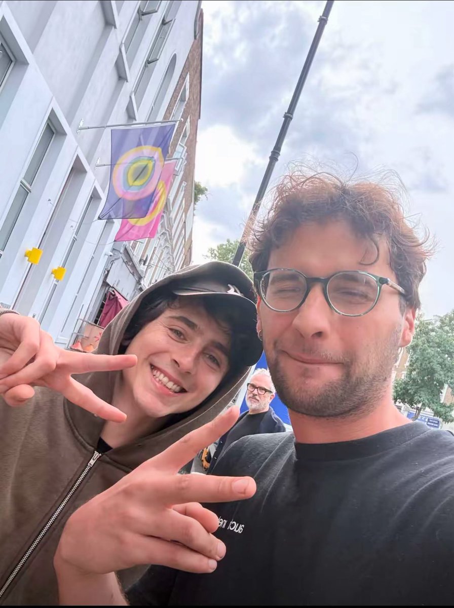 timotheenation's tweet photo. Timothée Chalamet with a fan in London. https://t.co/7hft4Mafc0