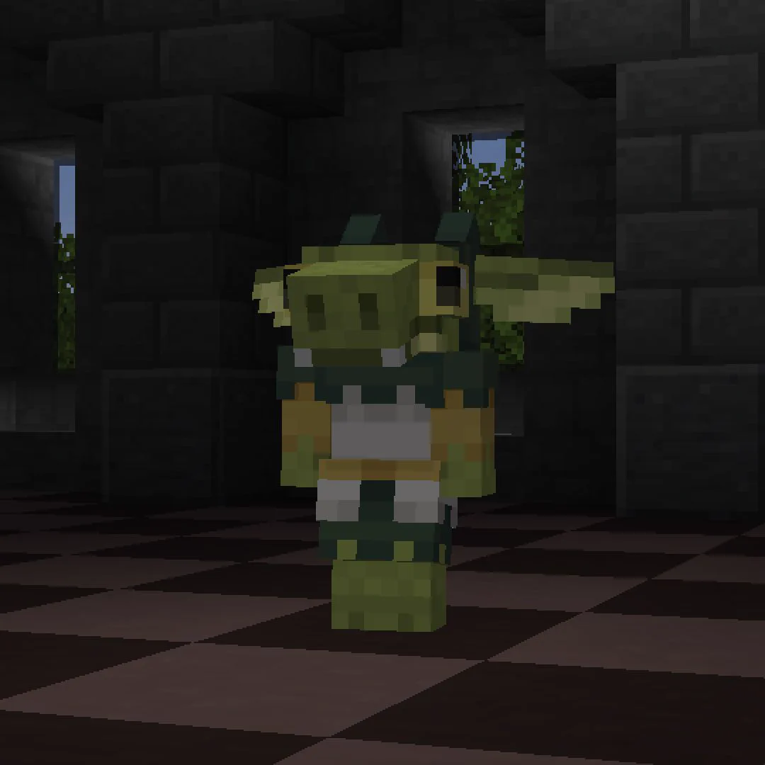 A Minecraft screenshot showing a small green kobold wearing a jester uniform standing in an empty room.
