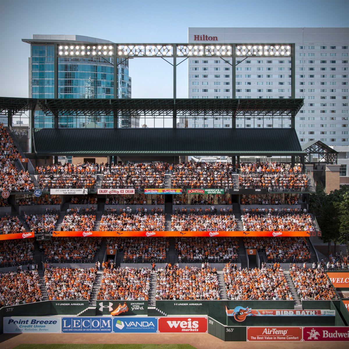 Orioles's tweet photo. A new way to experience The Yard is coming 👀

We're opening a brand-new social space in the left field upper deck next season, featuring a central bar, drink rails, standing-room views, diverse concession options, gathering areas, and more.

This new space will be open to all ticketed fans 🙌

Learn more ➡️ https://t.co/CsfasaD3se