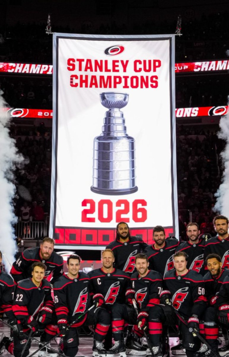 sportslogosnet's tweet photo. The Carolina Hurricanes raised their 2026 Stanley Cup banner and, in doing so, revealed a new championship banner design for the club. The 2006 banner has been updated to match.

See the new and the old designs in the pics here, which is better? https://t.co/KcuPrikELT