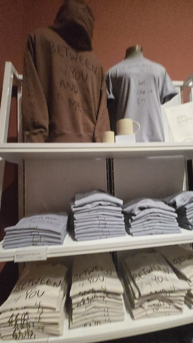 DeliaMary's tweet photo. Some #RMxSFMOMA merch. Sorry the pics are terrible, we only had an hour and I was focused on the art. I'll be going back on Thursday. The price list, as best as I could decipher, is:
$20 exhibition zine, teacup $30, mug $35, posters $40, hat $45, tote $65, tshirt $55. https://t.co/j6Al8r8lC3