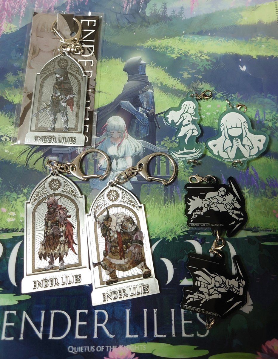 QuiLyune's tweet photo. グッズが増えたよ〜
1枚目上半分がNew! 騎士さんメタルキーホルダーとリリィちゃんの連結アクキー（ジャンプと浄化の祈り）
あと2枚目はステンレスタンブラー
#EnderLilies #エンダーリリィズ https://t.co/TyT59lTN5g