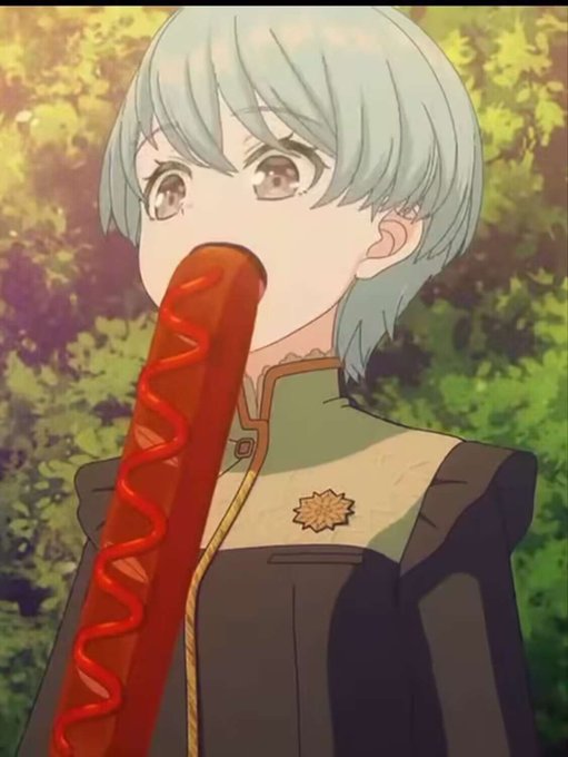 An anime-style illustration of a light-haired character in a dark uniform biting into a giant sausage with ketchup and mustard against a leafy background.