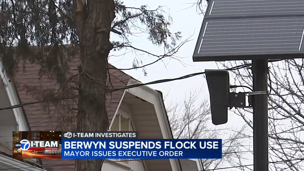 A news broadcast screenshot from ABC 7 I-Team Investigates with the headline 'BERWYN SUSPENDS FLOCK USE - MAYOR ISSUES EXECUTIVE ORDER', showing a surveillance camera mounted on a pole next to a solar panel and tree.