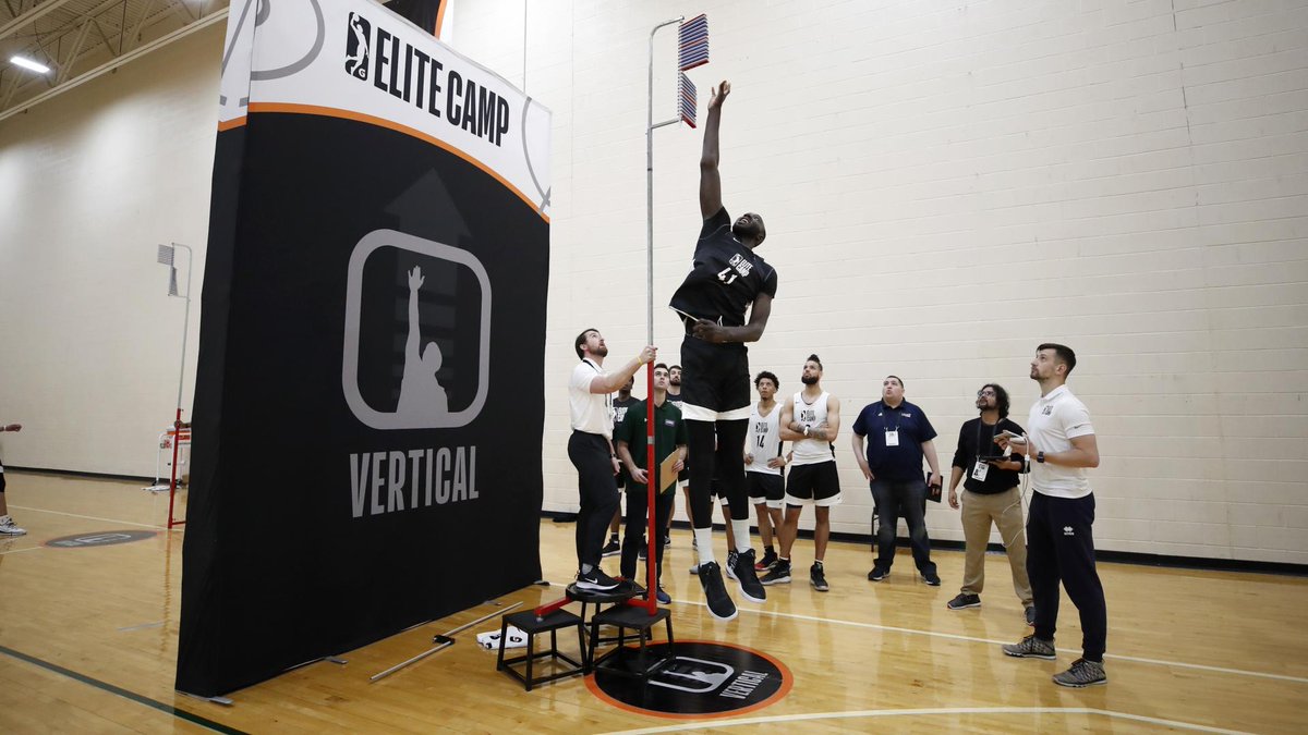 RyanPaganetti's tweet photo. Could the tallest player in NBA Combine history change the outcome of a Super Bowl?

Tacko Fall is in camp with the 76ers, but he hasn’t played in an NBA regular season game since 2021. I think an NFL team should test him as a field goal blocker.

At the NBA Combine, Fall measured 7’7” in shoes, with an 8’2¼” wingspan and a 10’2½” standing reach. All three set clear Combine records. His reported maximum vertical puts his best possible fingertip touch around 12½ feet. He is currently listed at 311 pounds.

Here is the strategy: put two interior defenders on one guard and give them one job. Drive him backward as far as possible. Do not jump. Do not stop to throw their hands up. Keep pushing. Fall rushes into the lane they create and times his jump to meet the kick.

From the field goal rushes I’ve reviewed, interior defenders often get roughly a yard of push on a normal rush, with plenty of reps producing considerably more. Players and special teams coaches I’ve talked to believe that two defenders focused entirely on driving a guard backward could move him more than two yards into the backfield on some kicks. The test is exactly how far they can move that player.

I analyzed 1,681 practice field goal kicks recorded with TrackMan’s ball tracking technology. Their median launch angle was 29.5°. Assuming an eight yard hold, my estimated median height for the bottom of the ball is roughly:

• 11’6” one yard into the backfield
• 10’0” two yards into the backfield

At two yards, that estimated height is below Fall’s standing reach *without jumping*. At one yard, it is well below his best possible jumping touch. These are modeled ball heights, not predictions of his block rate.

On either hash, I would start by testing the guard on the side toward the middle of the uprights. A live drill would measure the guard’s displacement, Fall’s timing and whether his hand actually reaches the ball’s path.

The formation and jump must follow NFL rules. His teammates cannot push him into the formation or give him extra lift. I found no numeric glove finger length limit in the published rulebook, but I’d seek league review before giving Tacko 10XL Mickey Mouse gloves.

From 2021 through 2025, just 1.9% of NFL field goal attempts were blocked, while about one in four regular season games ended within three points. Even a modest improvement in blocks could matter. I think the upside could be much larger.

There may also be a “Wembanyama effect”: even when Fall does not block a kick, his presence alone could disrupt the entire field goal operation and reduce accuracy.

There may be a red zone role, too. My best estimate from NFL defensive back data is that Fall’s standing reach is about 2½ feet higher than the average defensive back. That alone does not make him a receiver, but it makes a goal line package worth testing.

I’ve discussed versions of this with NFL players, coaches and a GM. I know that GM explored a way to test it, and an active special teams coach has shown interest.

When Fall’s basketball situation permits, bring him in for a controlled workout with a real snap, hold and protection unit. Measure what happens before making any roster decision.

Minimal downside to testing. Potentially enormous upside if it works. One team gets to find out first.