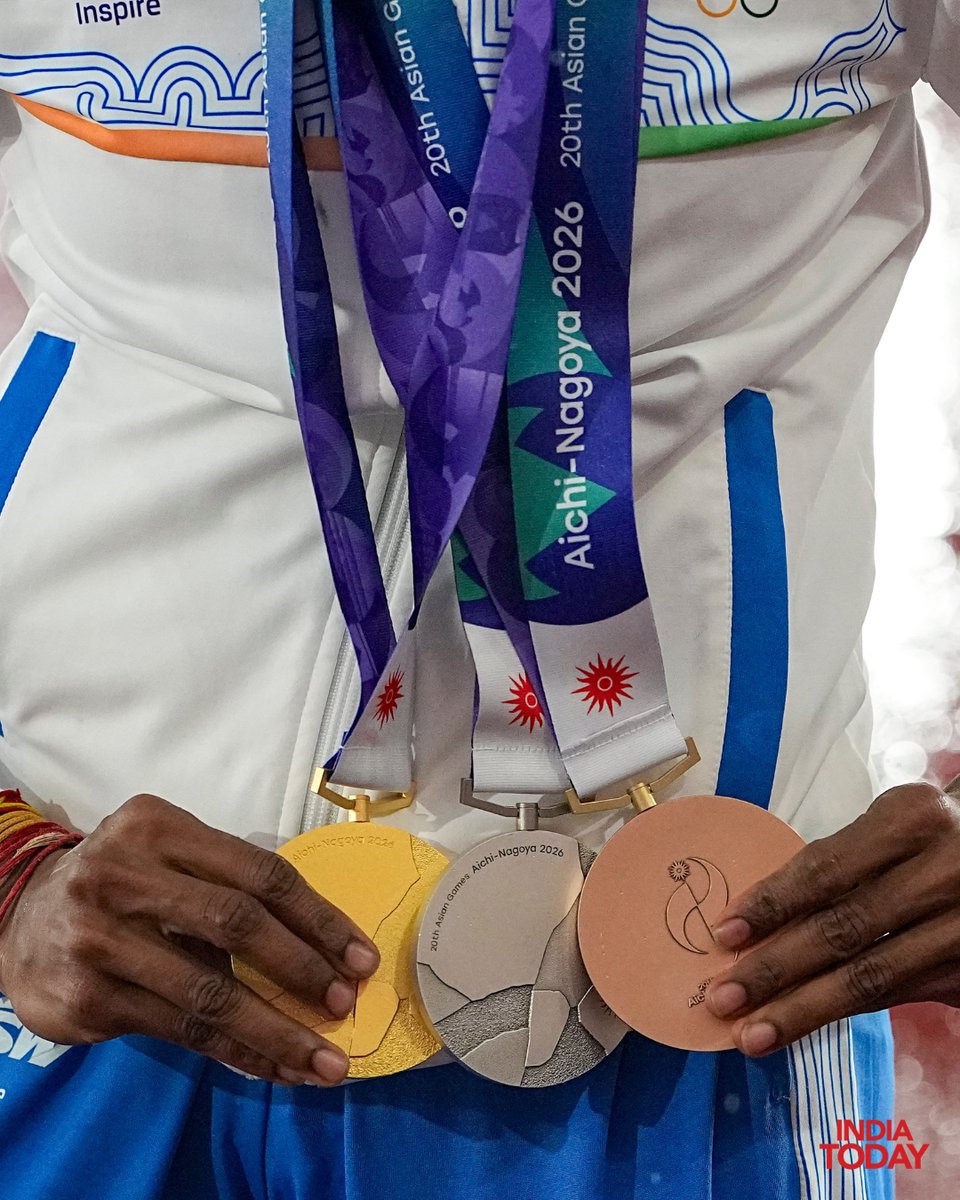 IndiaToday's tweet photo. #InPics | India's Vithya Ramraj poses with her gold, silver and bronze medals after her impressive medal haul at the Asian Games 2026 in Nagoya, Japan. She won gold in the women's 4x400m relay, silver in the 4x400m mixed relay and bronze in the women's 400m hurdles.

#VithyaRamraj #AsianGames2026 #IndiaAtAsianGames #IndianAthletics #IndiaTodaySocial