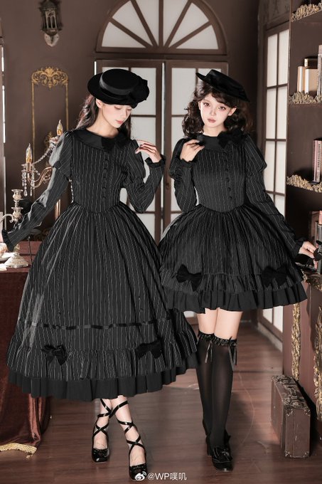 Two women modeling black, pinstriped Gothic Lolita-style dresses with matching berets, one a long dress with ruffled hem and the other a shorter version with knee-high stockings, with a "@WP噗叽" watermark in the corner.