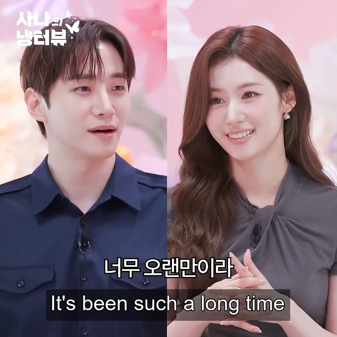 The image is a split-screen still from a Korean variety show titled "사나의 남타뷰" (Sana's Namtaview), featuring Sana smiling warmly in a gray blouse alongside a male interviewer in a navy shirt, with subtitles reading "너무 오랜만이라 / It's been such a long time." The post's comment about "Sana looking so grown here" fits perfectly, as her sophisticated styling, soft glam makeup, and elegant wavy hair give her a notably mature, polished appearance compared to her usual TWICE idol image.