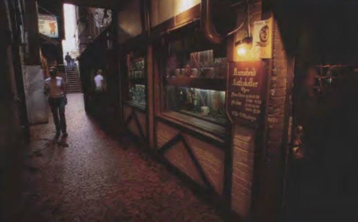 bud33345's tweet photo. On this day in North Carolina history September 30, 1948.

The Rams Head Rathskeller opened down in Amber Alley off Franklin Street in Chapel Hill. Folks just called it The Rat.

Ted Danziger and his family opened it in the basement under the old candy shop. They were Austrian folks who came over here and started over in Chapel Hill. First place around there to pour draft beer. Pizza showed up a few years later and that was a big deal for this part of the country back then.

The Daily Tar Heel ran an ad saying Andy Griffith was gonna wander around with his guitar welcoming people in. Think about that. Andy Griffith playing in a basement restaurant the night it opened.

That place fed generations of UNC students. Lasagna they called the bowl of cheese. The Gambler steak. Waiters who stayed for decades. Initials carved in the wood. Dates. Cheap beer. Loud nights. It was not fancy and it was not supposed to be.

The Rat closed in 2007. Building still sitting there under Franklin Street. Different things have come and gone in that space since.

If you ever ate there you remember it. If you never did, you missed a Carolina institution.

First picture is the alley entrance.
Black and white picture is the view from Franklin St. Old World Gift Shop upstairs and The Rat downstairs.