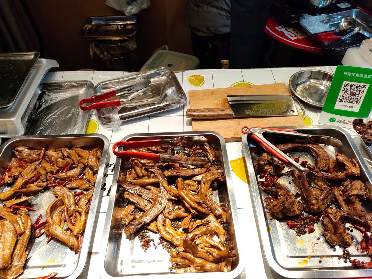 pinklysm's tweet photo. Just encountered a group of 悍卤牙 fighting over a bite of meat at the snack street—loud, messy, but strangely cute. https://t.co/O6C5a71az6