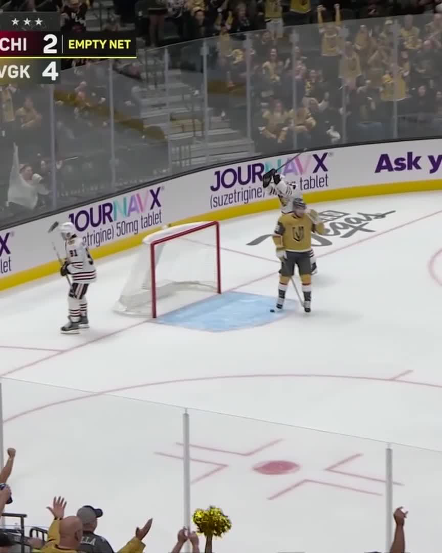 Vegas Golden Knights players celebrate near the goal after Mark Stone scored into the empty net, with the scoreboard showing CHI 2, VGK 4, confirming the final tally of the game.