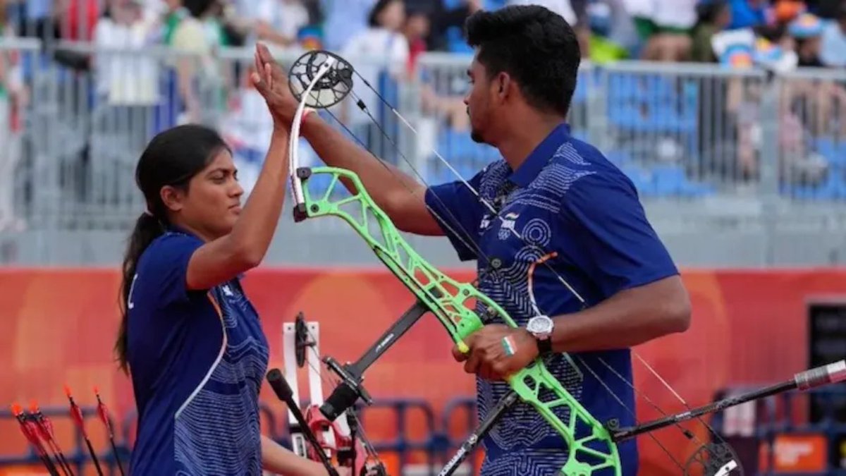 TNPNEWS1's tweet photo. Asian Games 2026: भारत का एक और गोल्डन जीत, कंपाउंड मिक्स्ड टीम ने रचा इतिहास 
https://t.co/xs9pLOoJ1T

#asiangames2026 #indiagoldmedal #compoundmixedteam @AsianGamesOCA @PMOIndia https://t.co/eln315FZcH