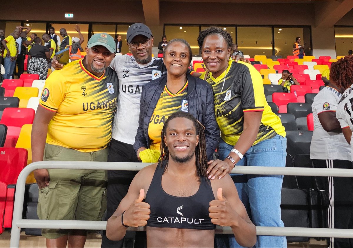 UgandaCranes's tweet photo. Sweet family, Cranes moment! ❤️💛🖤

Uganda Cranes defender Nathan Asiimwe gifted his match jersey to his family who travelled  to support him in Hoima.
Family, football and country nothing sweeter than that!
Uganda 1-0 Libya 
#TotalEnergiesAFCON2027 https://t.co/c9znRfaNok