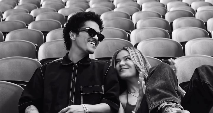 aweeex's tweet photo. Still” now has an official music video, with Karol G and Bruno Mars making their chemistry central to the story. Blending black-and-white footage, backstage moments, and their SoFi Stadium performance, the intimate English-language track explores https://t.co/otigIHdPto