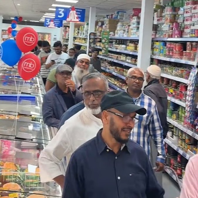 DailyMail's tweet photo. Customers at Asian supermarket form separate male and female queues as they wait in line https://t.co/2QWYYVFG9P