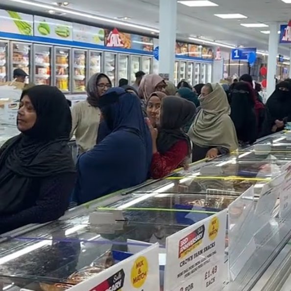 DailyMail's tweet photo. Customers at Asian supermarket form separate male and female queues as they wait in line https://t.co/2QWYYVFG9P