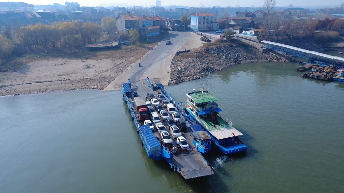 ina_drex274's tweet photo. At the old wharf, a few trucks are parked by the warehouse, where a shell of an old ship lies quietly by the Fen river. https://t.co/MhqvsZ5n94